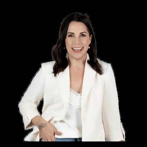 Professional headshot of a woman with dark hair wearing a white blazer and white top, smiling at the camera against a black background