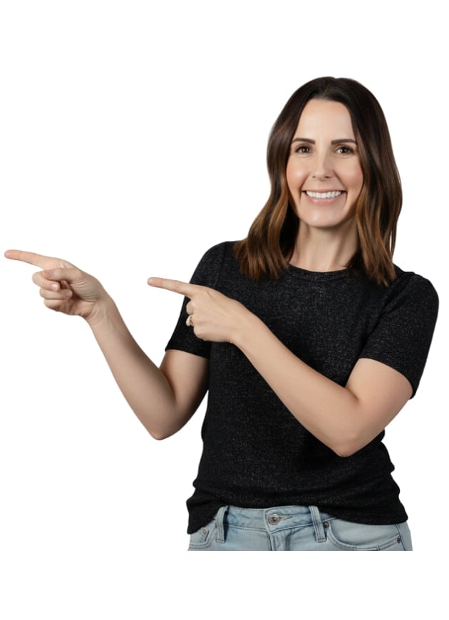 Smiling woman in black shirt pointing both hands to the left against white background
